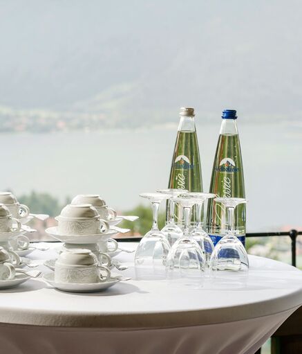 Hotel Der Westerhof meetings with a view of Lake Tegernsee Coffee break Fresh pretzels and bottles of water on the bistro table